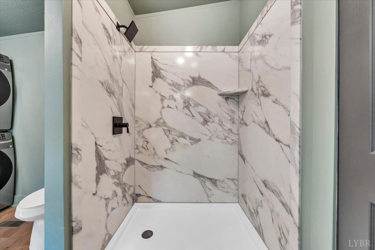 2781 Johnson School Road Thaxton, VA 24174 - Photo 41 of 63 a bathroom with a shower and a tub