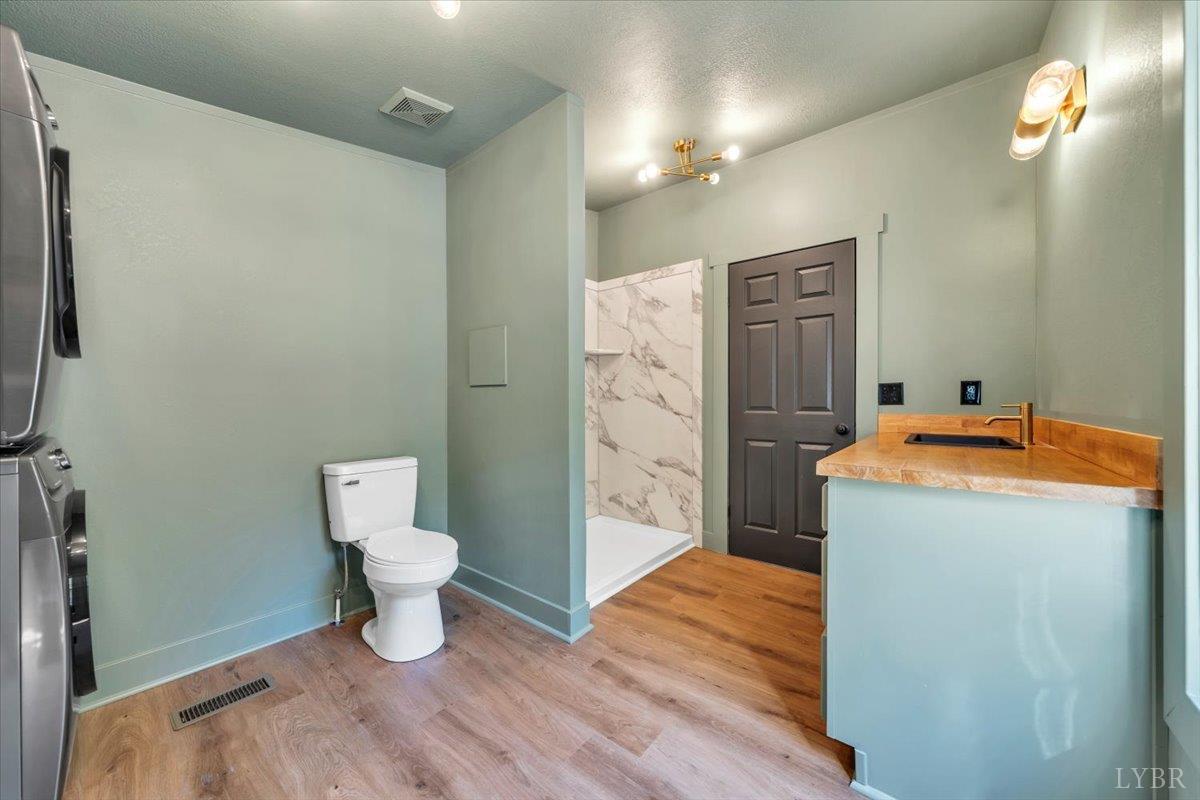 2781 Johnson School Road Thaxton, VA 24174 - Photo 42 of 63 a bathroom with a toilet sink and shower