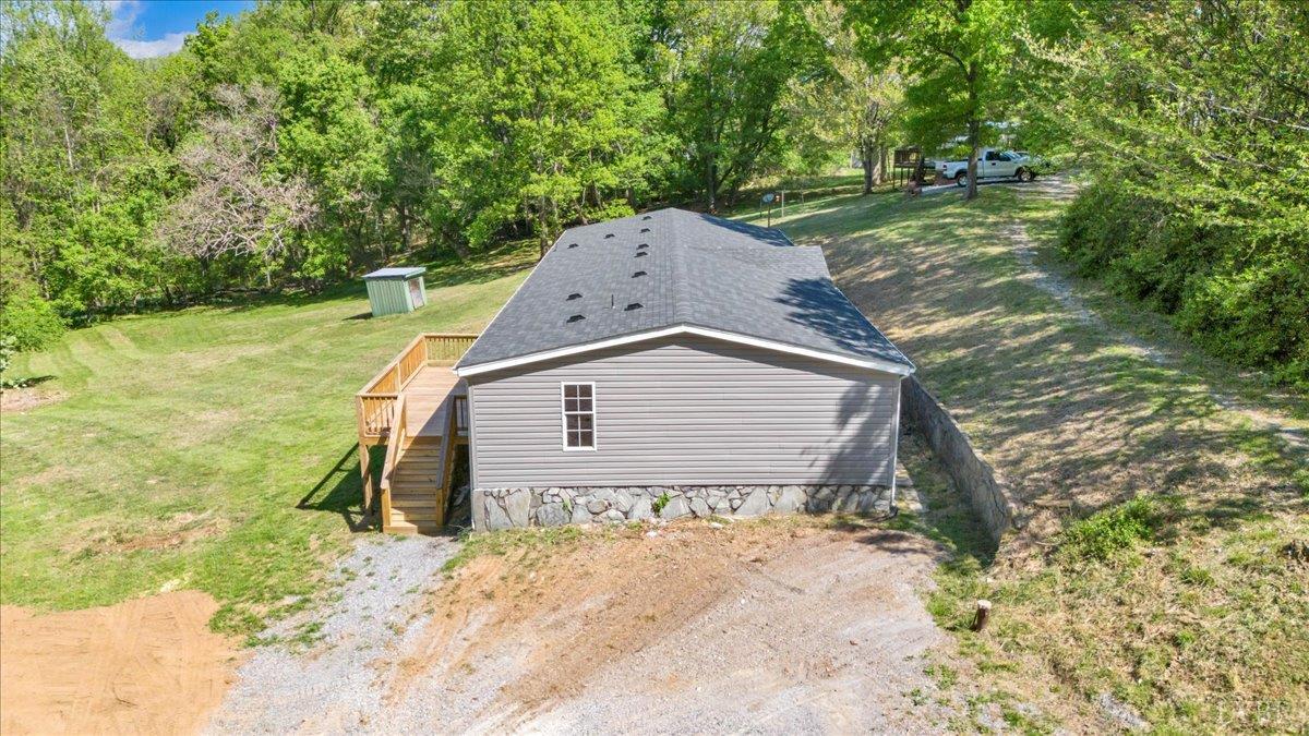 2781 Johnson School Road Thaxton, VA 24174 - Photo 54 of 63 a backyard of a house with a yard and outdoor seating