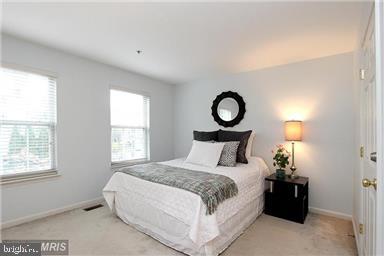 11864 Breton Court, Unit 14A Reston, VA 20191 - Photo 15 of 26 a bedroom with a bed and window