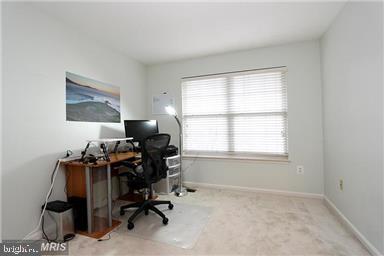 11864 Breton Court, Unit 14A Reston, VA 20191 - Photo 19 of 26 a view of a workspace with furniture and a window