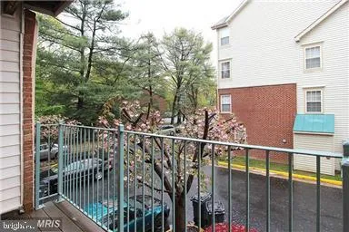 a view of a balcony with a tree