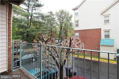 11864 Breton Court, Unit 14A Reston, VA 20191 - Photo 20 of 26 a view of a balcony with a tree
