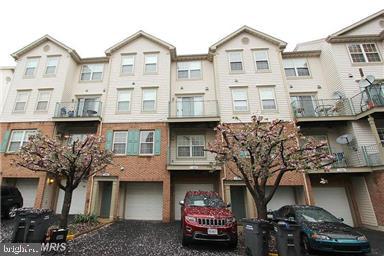 11864 Breton Court, Unit 14A Reston, VA 20191 - Photo 21 of 26 a car parked in front of a building