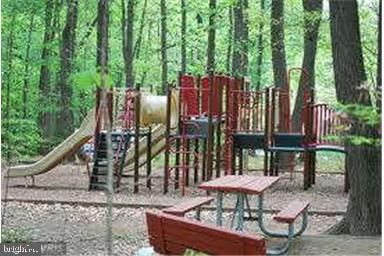 11864 Breton Court, Unit 14A Reston, VA 20191 - Photo 26 of 26 a view of a chairs and table in the backyard