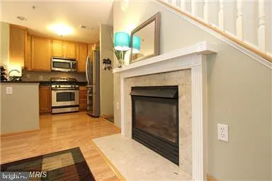 a kitchen with stainless steel appliances a stove and a microwave