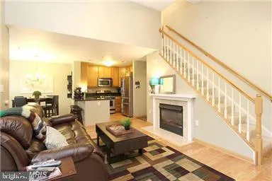 a living room with furniture fireplace and flat screen tv
