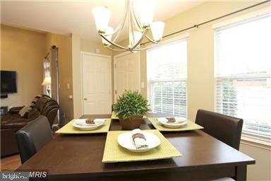 11864 Breton Court, Unit 14A Reston, VA 20191 - Photo 8 of 26 a living room with furniture and a table
