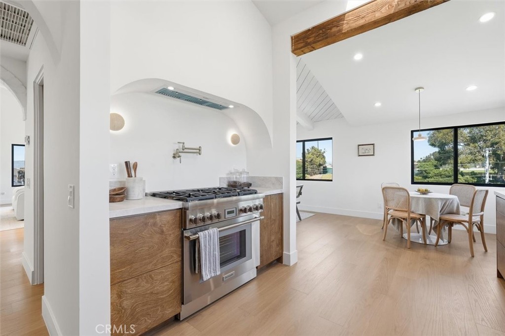 8140 Calabar Avenue Playa del Rey, CA 90293 - Photo 16 of 60 a kitchen with a stove and a wooden floor