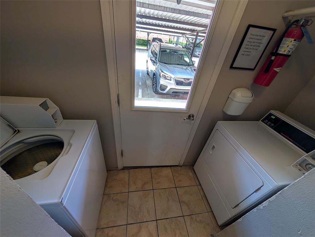 4715 Skillman Street, Unit A Dallas, TX 75206 - Photo 27 of 28 Laundry area with tile flooring and exterior door with window