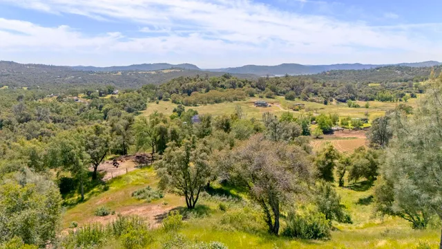 a view of a town with mountains in the background