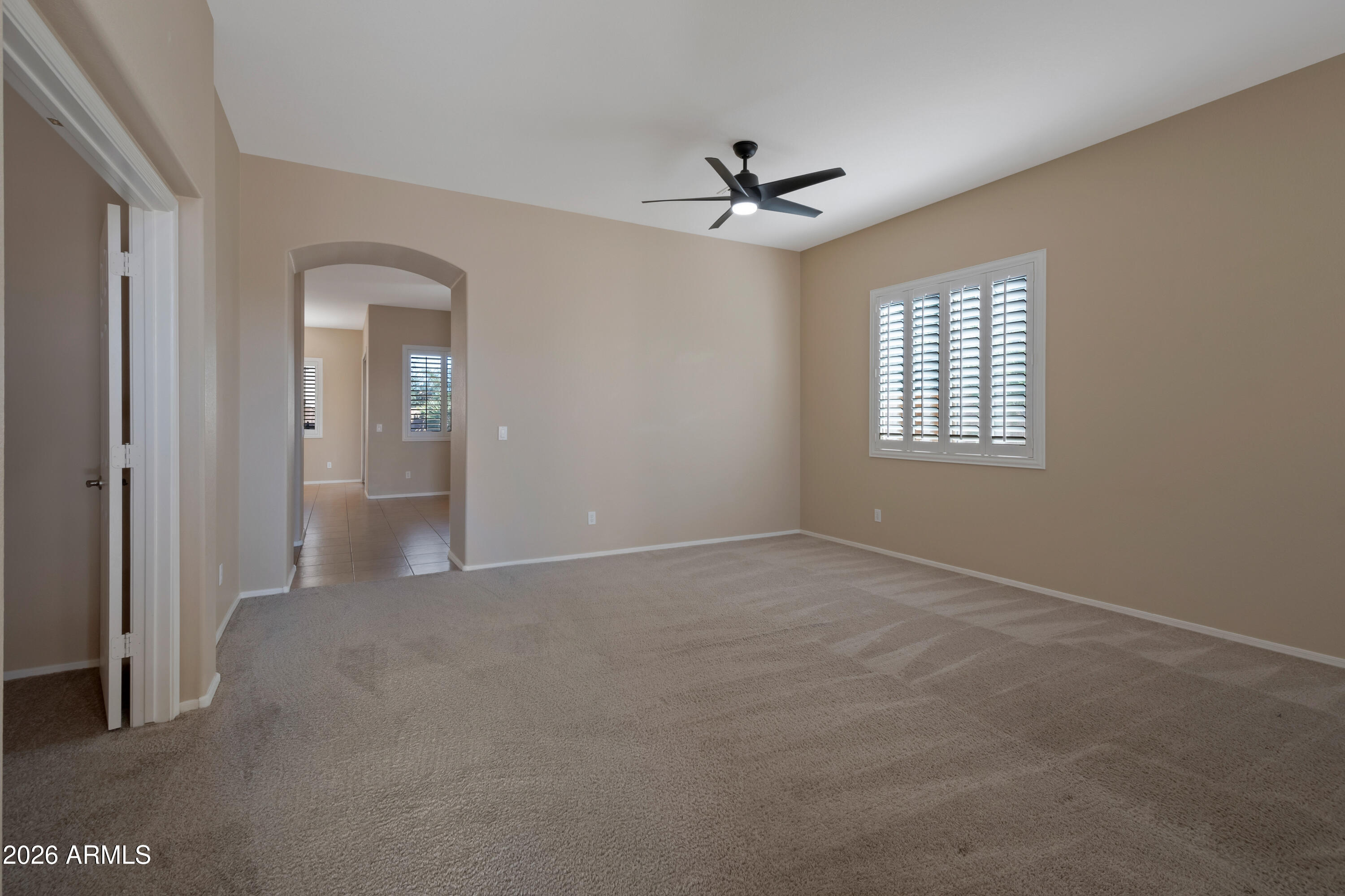 1912 East Flintlock Way Chandler, AZ 85286 - Photo 5 of 34 a view of an empty room with a window