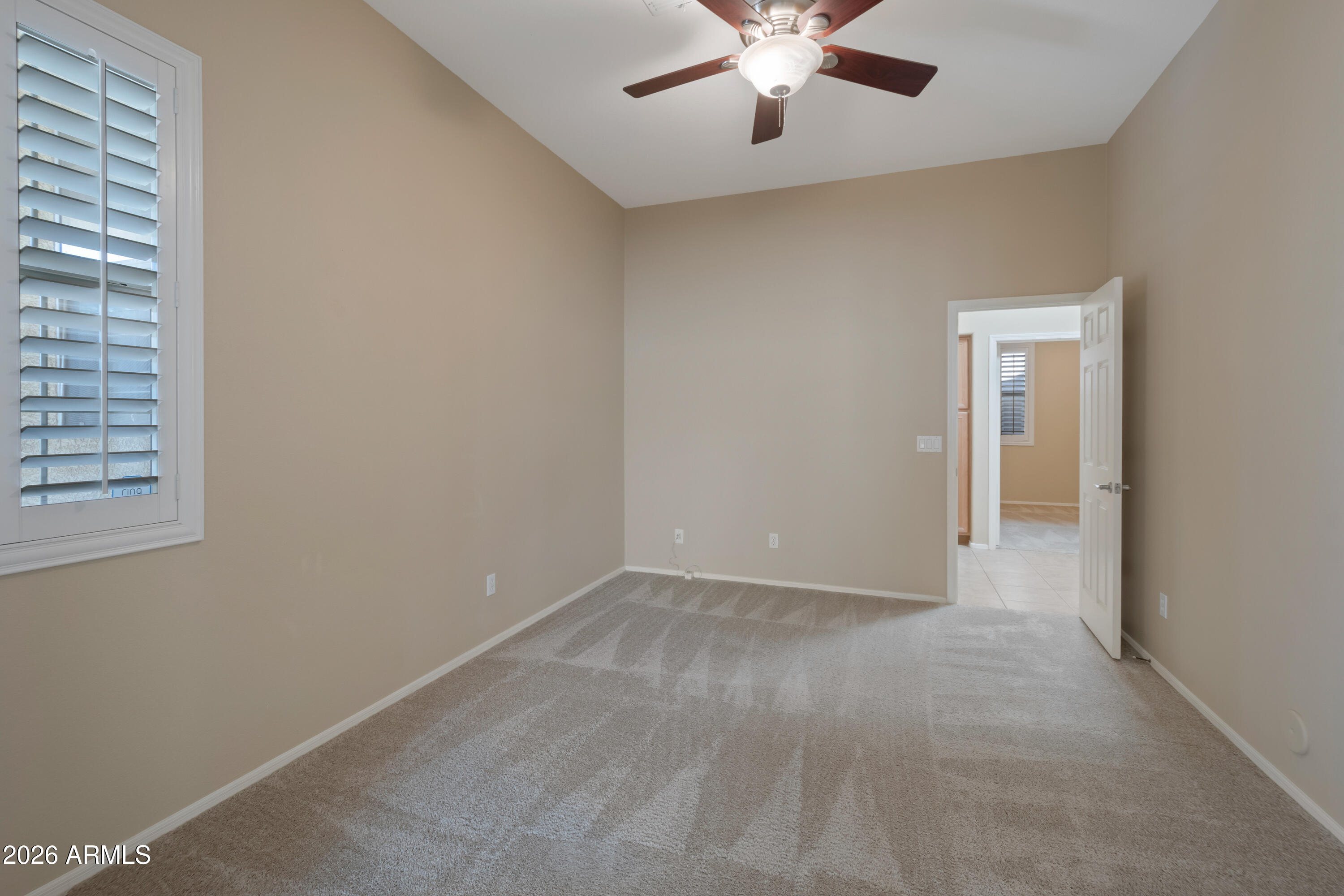 1912 East Flintlock Way Chandler, AZ 85286 - Photo 7 of 34 an empty room with chandelier fan