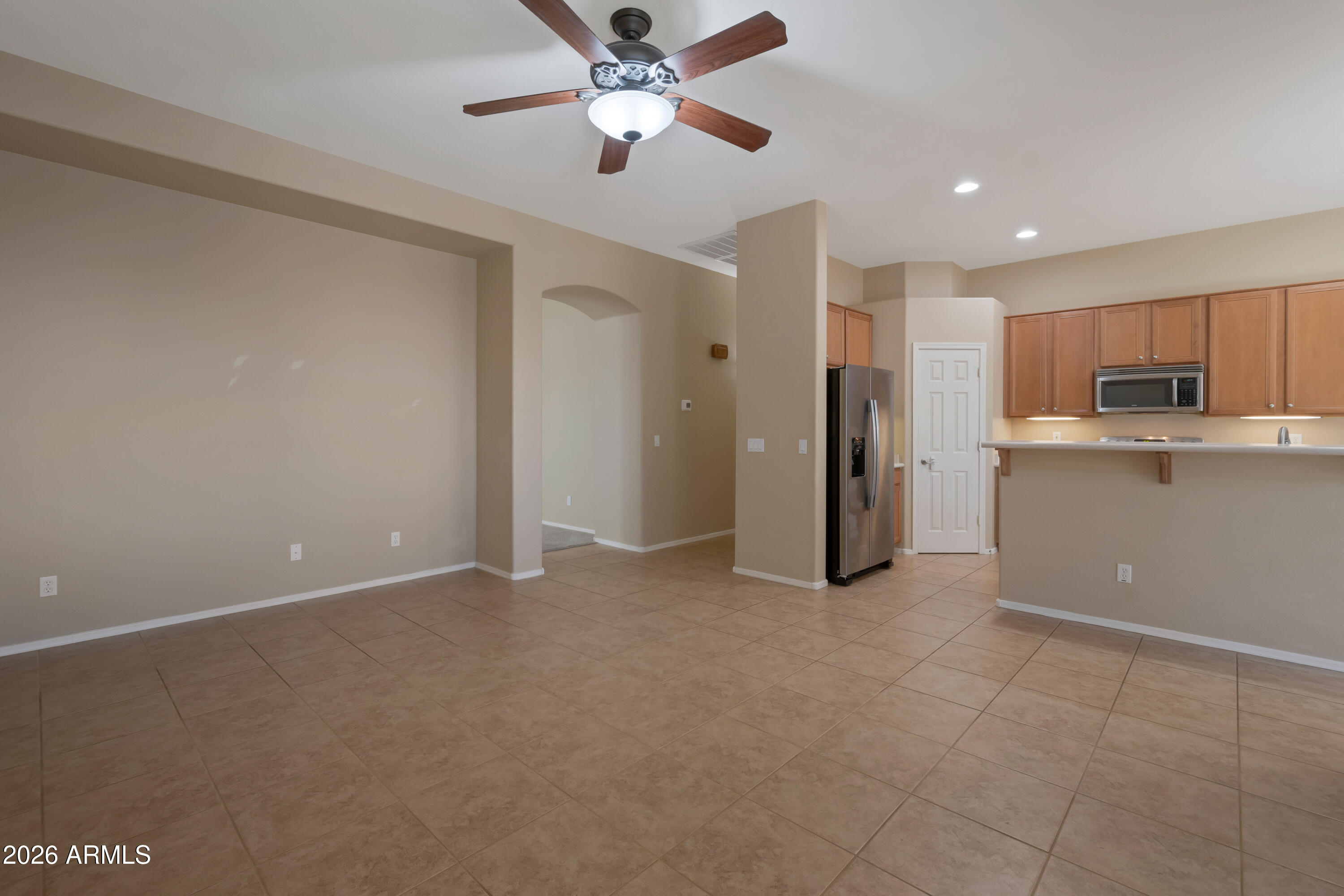 1912 East Flintlock Way Chandler, AZ 85286 - Photo 10 of 34 a view of a kitchen with a sink and a refrigerator