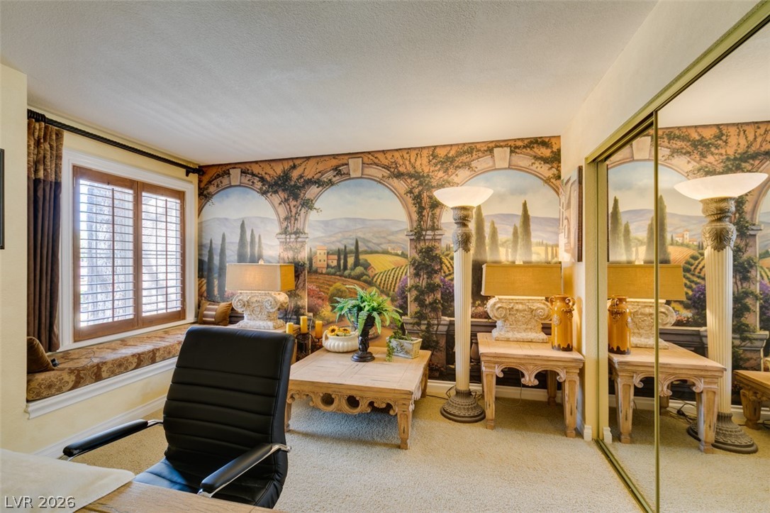 9325 West Desert Inn Road, Unit 244 Las Vegas, NV 89117 - Photo 27 of 55 An inviting study features a scenic wall mural and sun-drenched window seat.