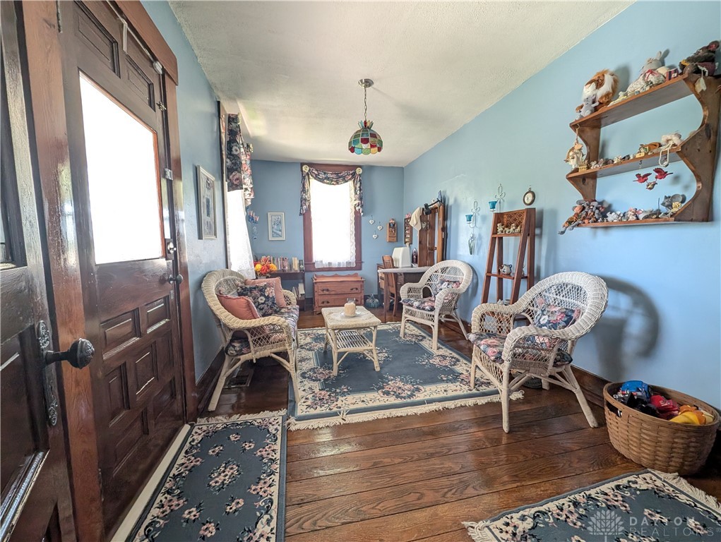 8713 Oakes Road Arcanum, OH 45304 - Photo 20 of 29 This inviting space features classic hardwood flooring, creating a cozy and warm atmosphere.