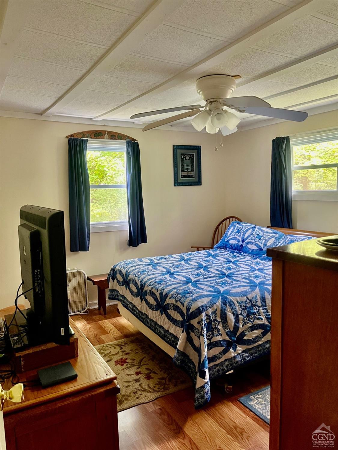 83 Ufferts Road Catskill, NY 12414 - Photo 15 of 29 a bedroom with a bed and two windows