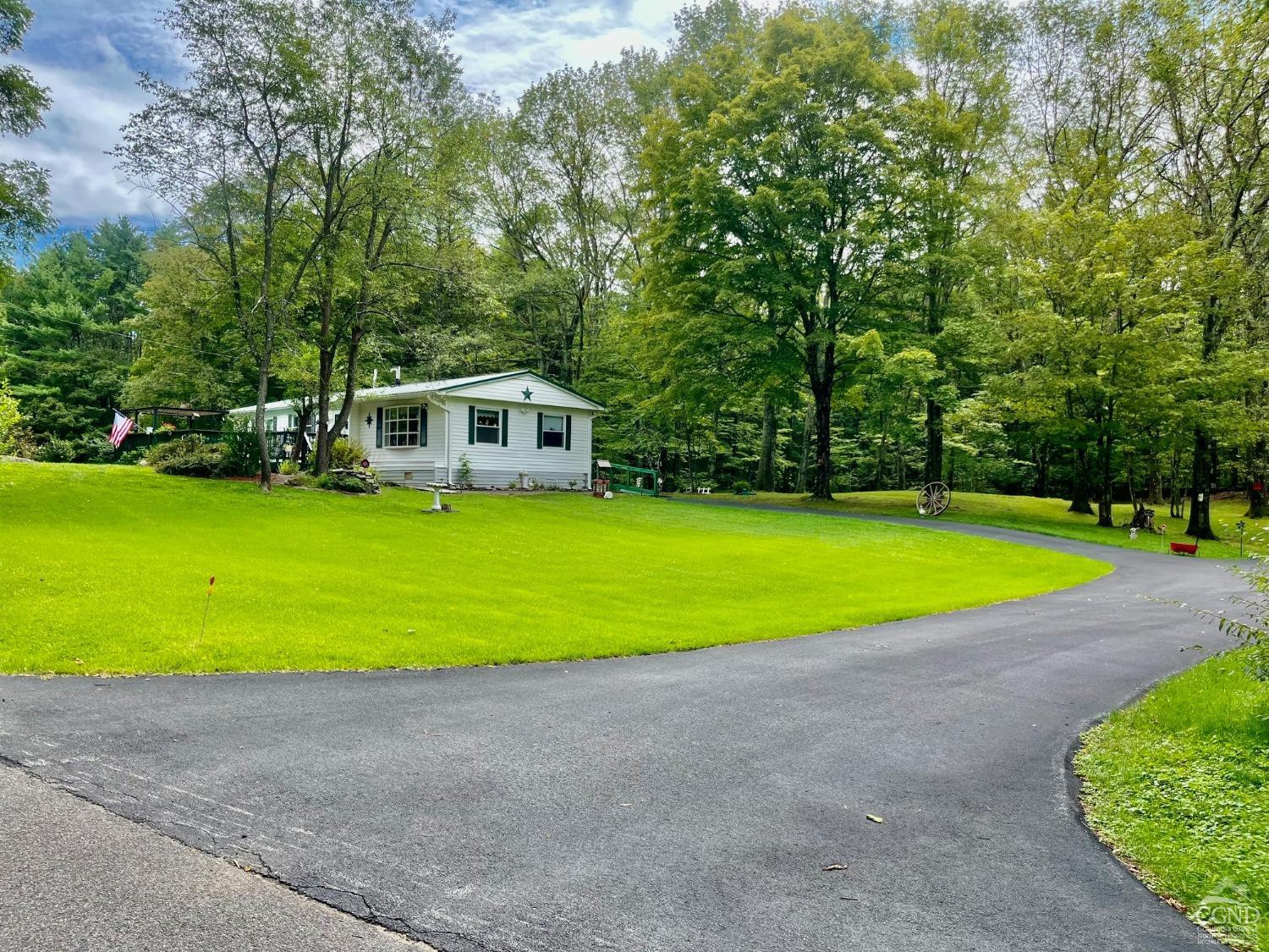 83 Ufferts Road Catskill, NY 12414 - Photo 19 of 29 a view of a house with a yard and sitting area