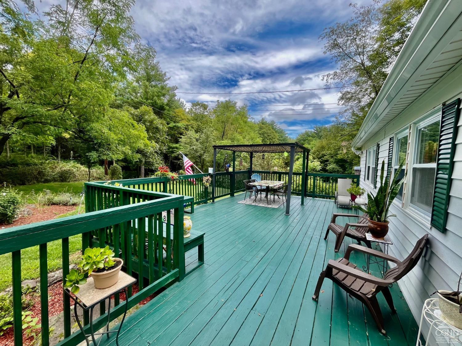83 Ufferts Road Catskill, NY 12414 - Photo 20 of 29 a view of a chairs and table on the wooden deck