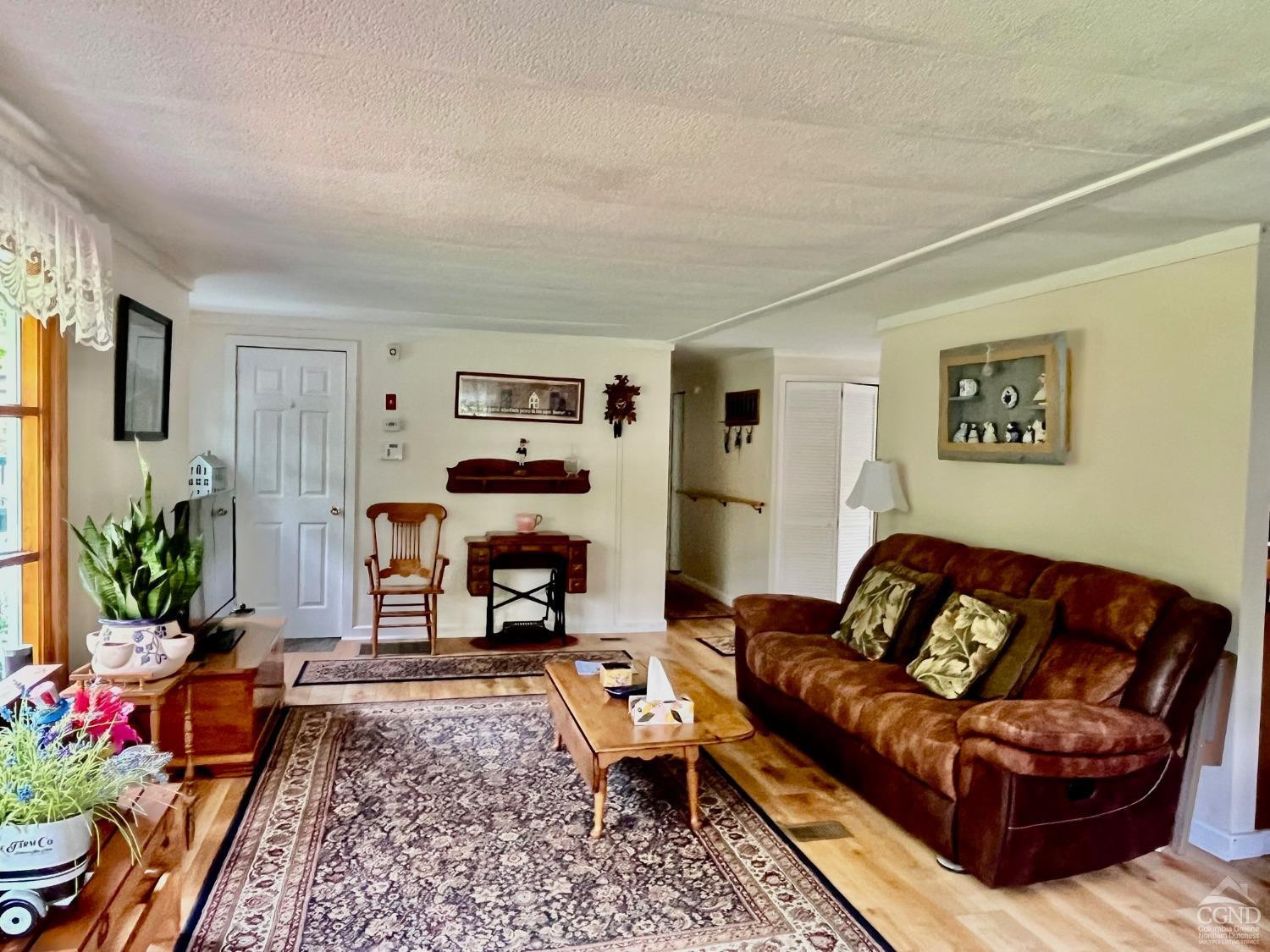 83 Ufferts Road Catskill, NY 12414 - Photo 5 of 29 a living room with furniture and a couch
