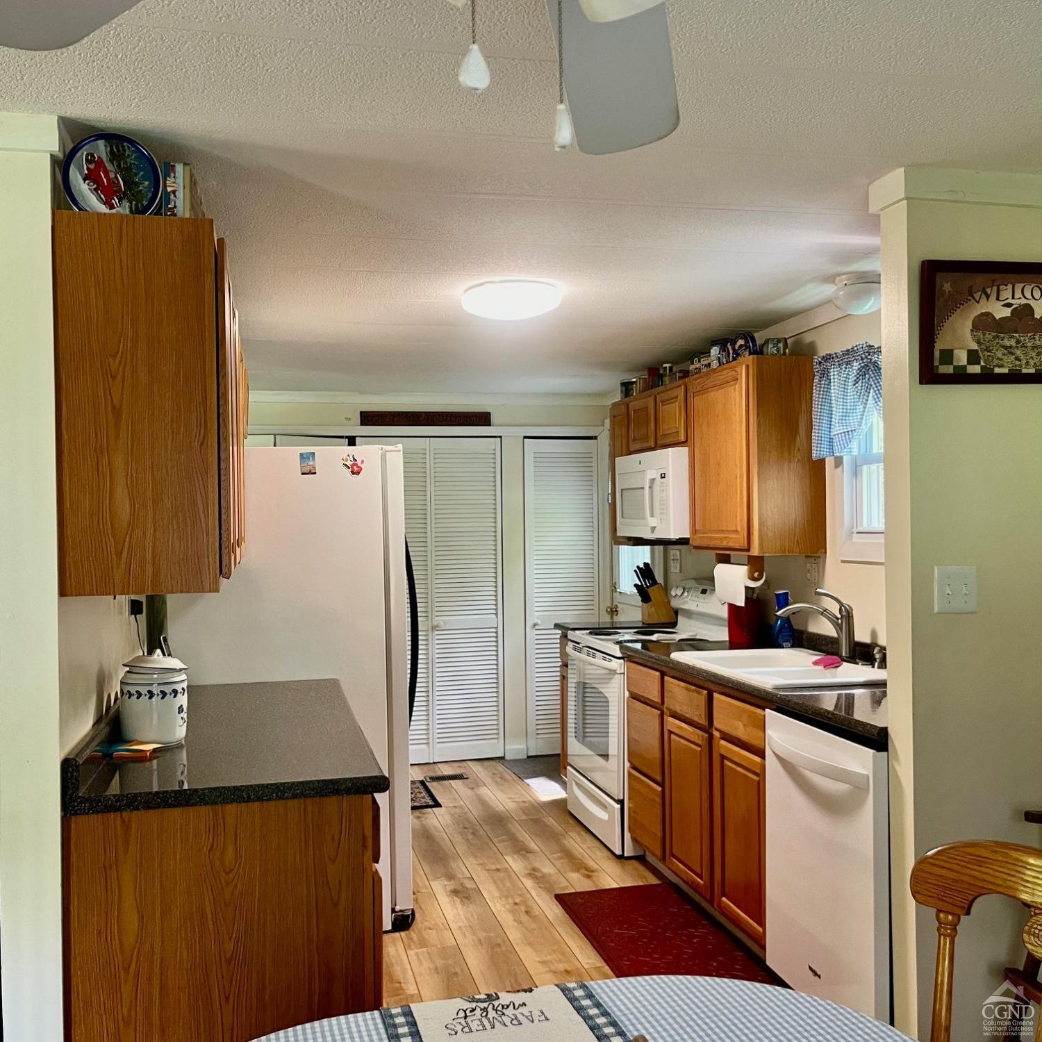 83 Ufferts Road Catskill, NY 12414 - Photo 8 of 29 a kitchen with a sink a stove and cabinets