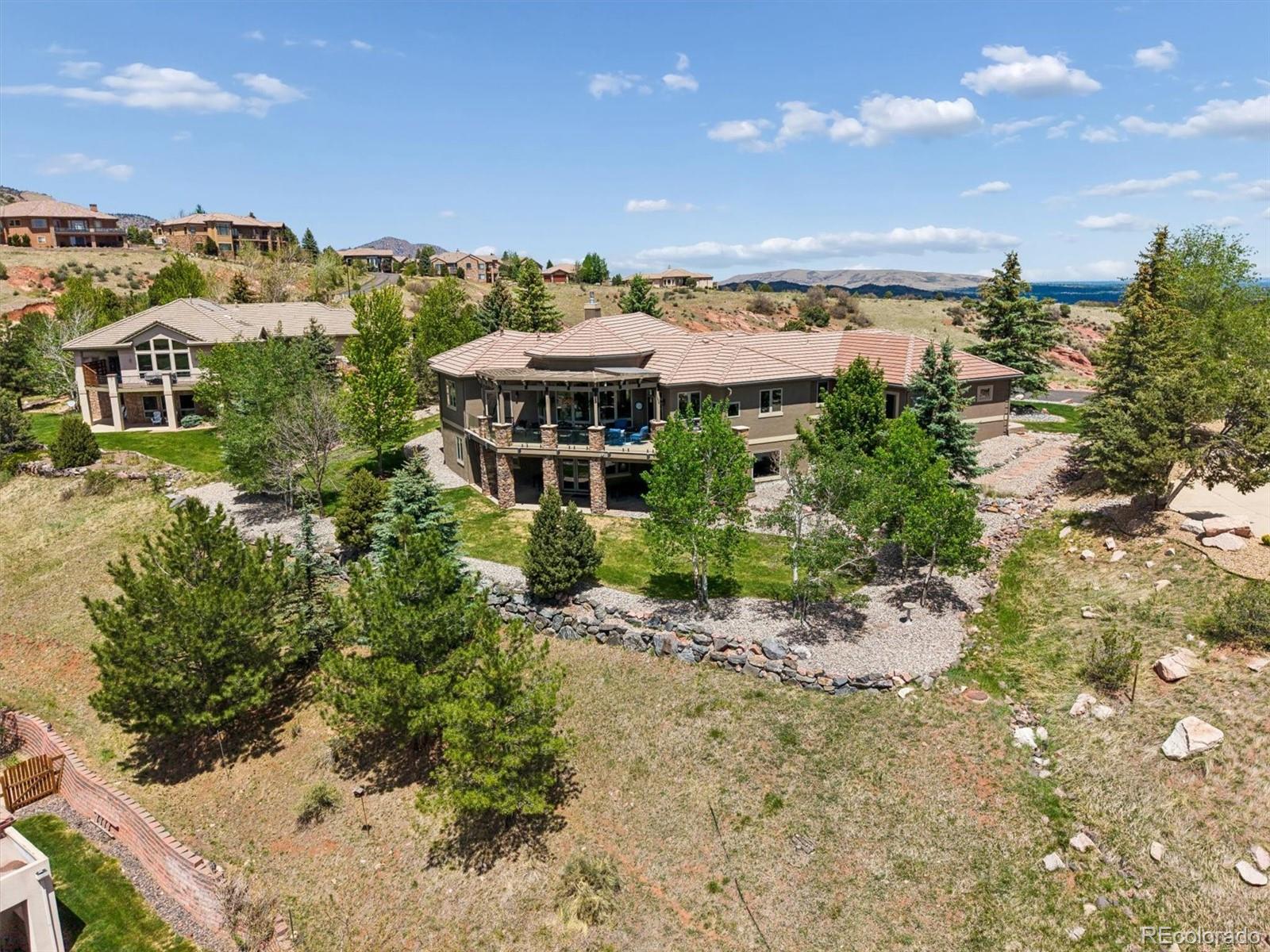16422 Rocky Point Lane Morrison, CO 80465 - Photo 42 of 50 a view of a city and mountains in the background