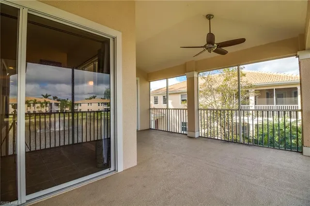 a view of a room with a sliding door and wooden floor