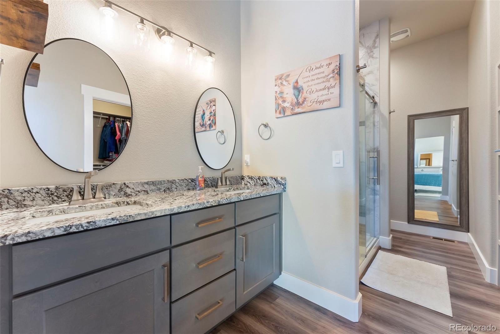 489 Duesouth Road Florissant, CO 80816 - Photo 17 of 45 a bathroom with a granite countertop sink and a mirror