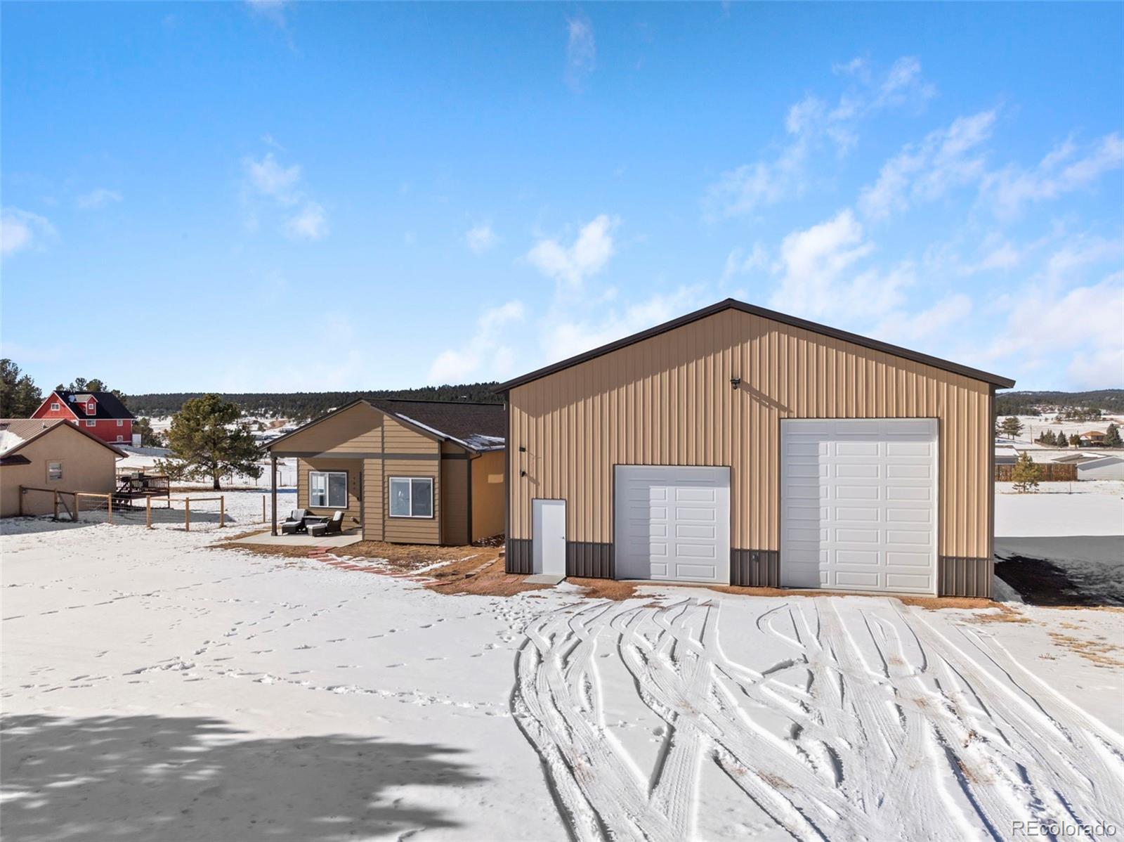 489 Duesouth Road Florissant, CO 80816 - Photo 33 of 45 a view of a house with a yard