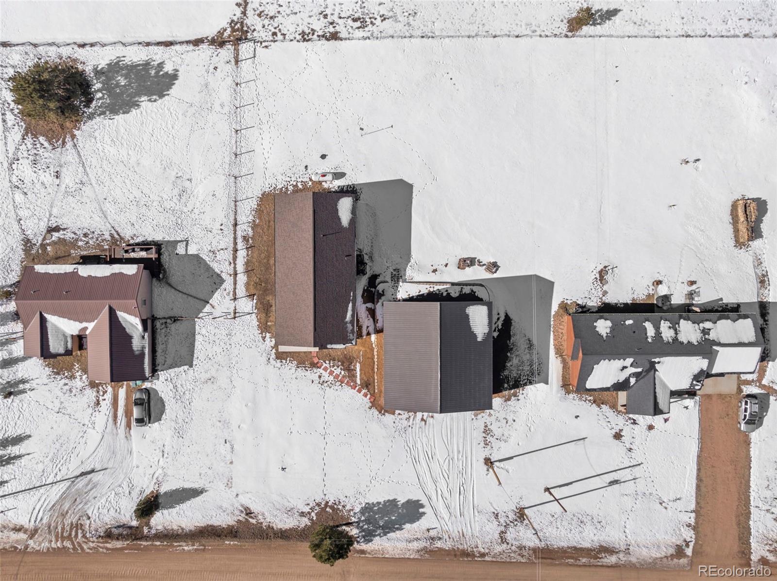 489 Duesouth Road Florissant, CO 80816 - Photo 36 of 45 a bed room with a bed and a table