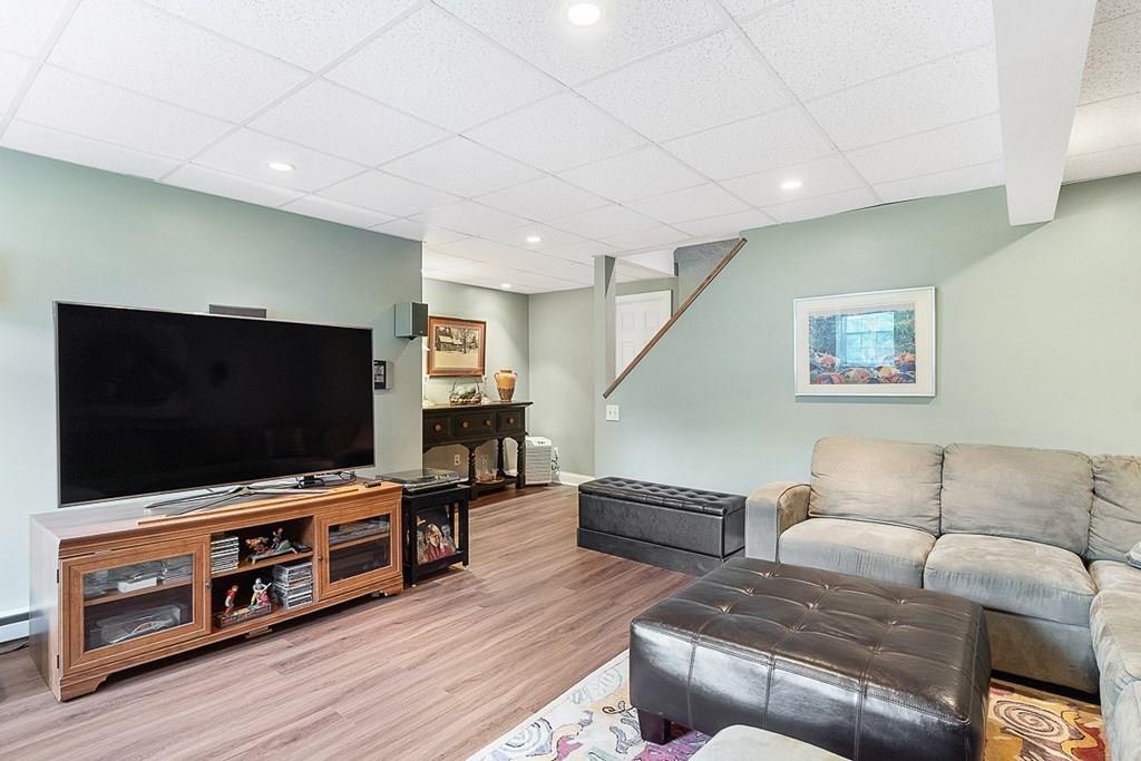 9 Bernard Road Rutland, MA 01543 - Photo 32 of 41 a living room with furniture and a flat screen tv