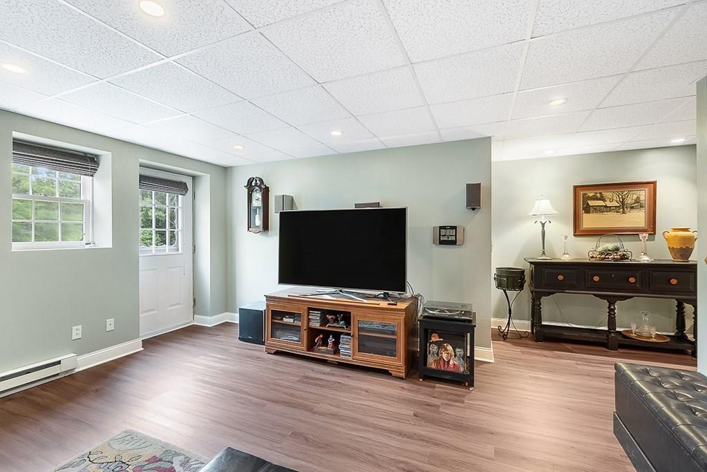 9 Bernard Road Rutland, MA 01543 - Photo 33 of 41 a living room with furniture and a flat screen tv