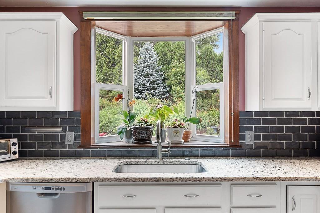 9 Bernard Road Rutland, MA 01543 - Photo 7 of 41 a kitchen with granite countertop a sink and a window