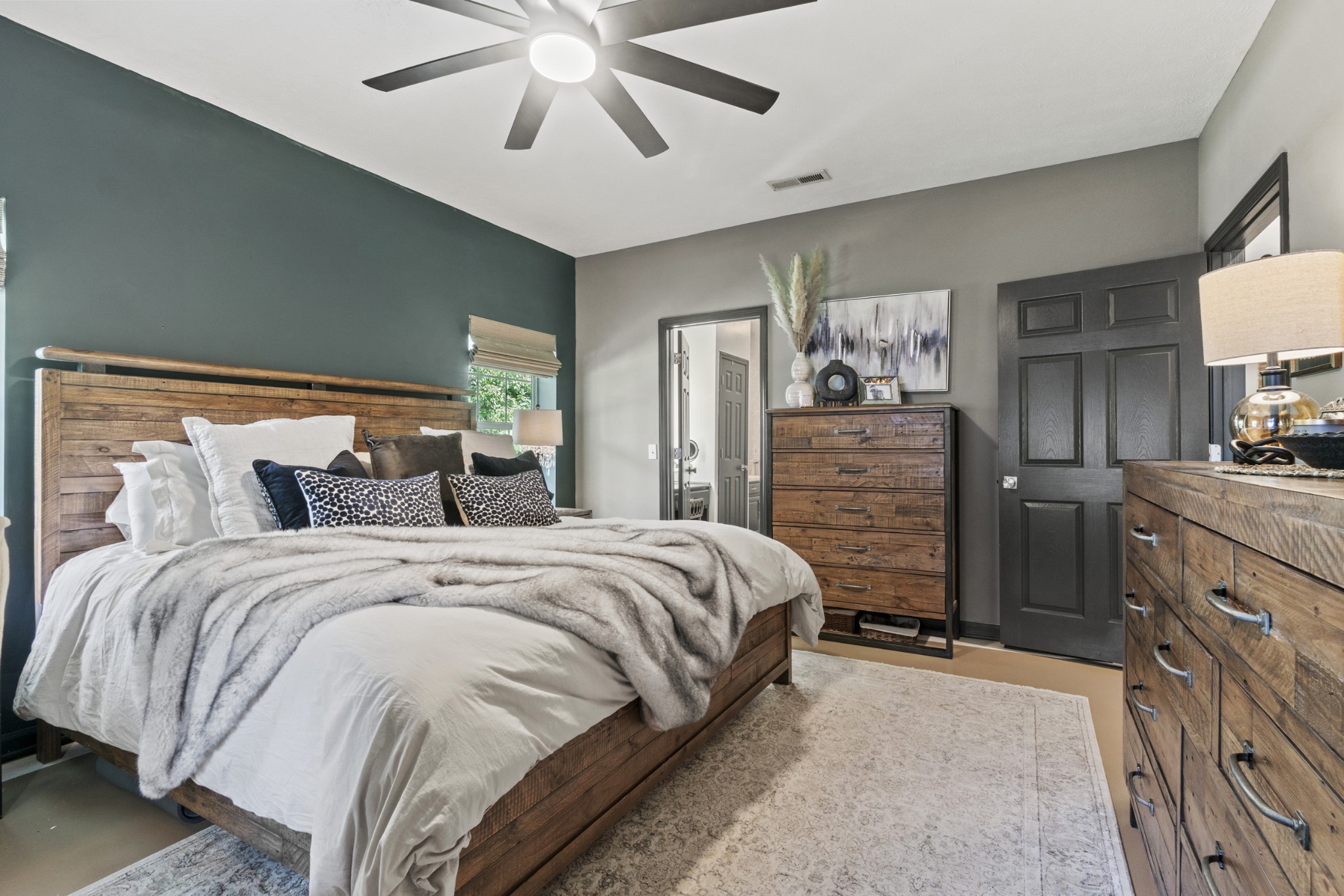 3336 Green Grove Road Hartsville, TN 37074 - Photo 19 of 64 a bedroom with a bed and a chandelier