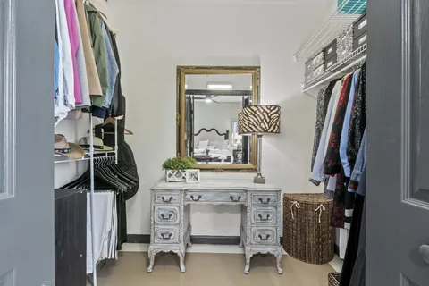 a view of a house with backyard sitting area and garden