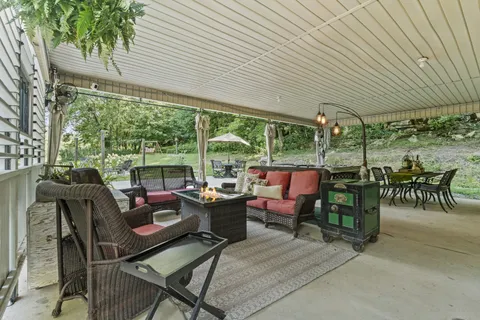 a view of a table and chairs in the garden