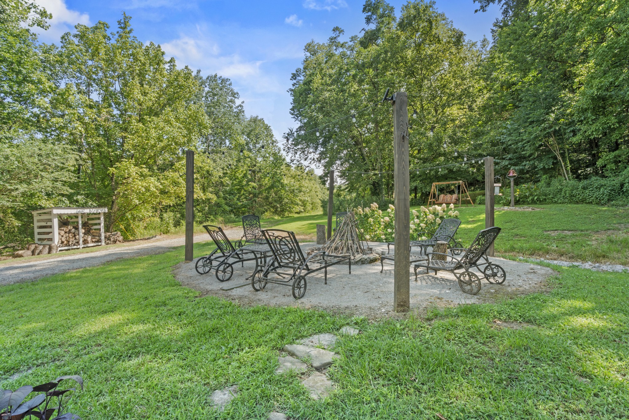 3336 Green Grove Road Hartsville, TN 37074 - Photo 25 of 64 a view of a table and chairs in the garden