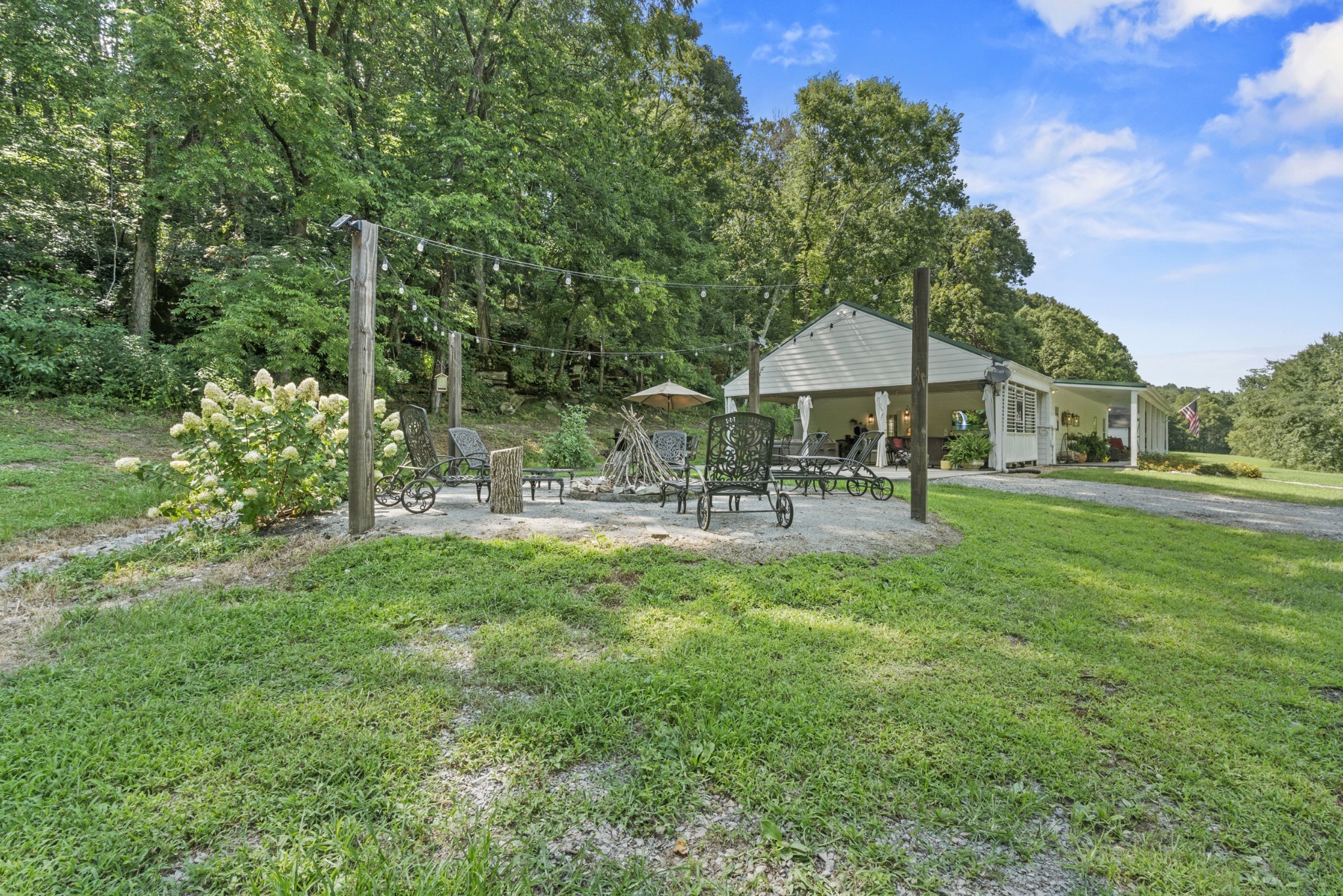 3336 Green Grove Road Hartsville, TN 37074 - Photo 26 of 64 a backyard of a house with table and chairs