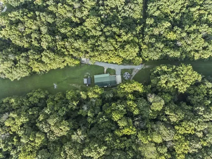 a house view with a sitting space and garden