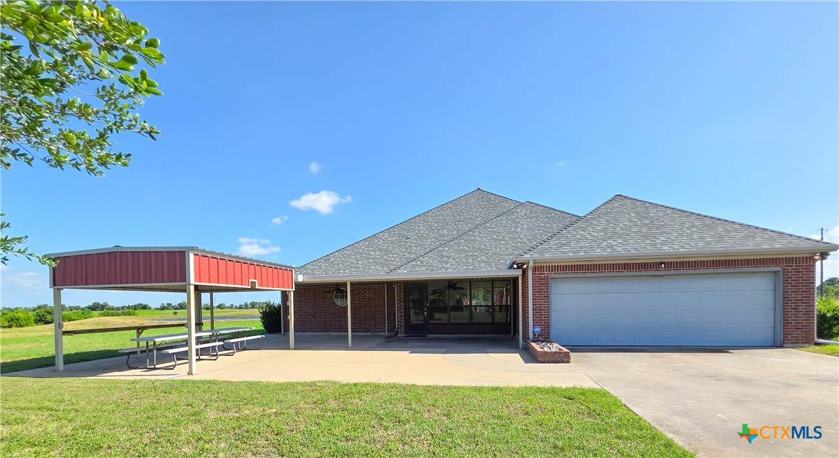 2450 West Amity Road Belton, TX 76513 - Photo 22 of 33 Rear of home with splendid shaded patio and picnic seating looking out toward the water.
