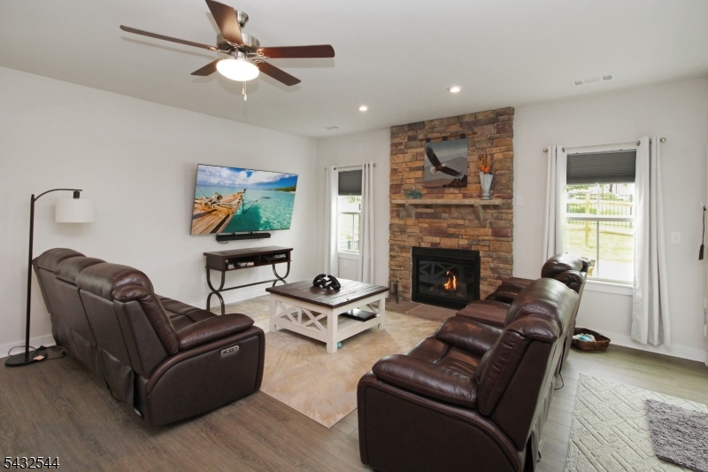 21 Harris Hawk Road Washington, NJ 07882 - Photo 11 of 26 a living room with furniture and a fireplace
