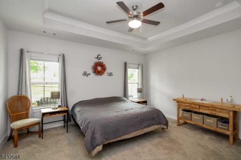 21 Harris Hawk Road Washington, NJ 07882 - Photo 14 of 26 a bedroom with a bed and a window
