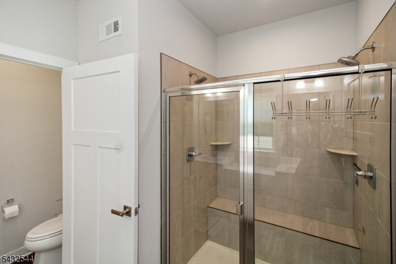 21 Harris Hawk Road Washington, NJ 07882 - Photo 15 of 26 a bathroom with a glass door shower