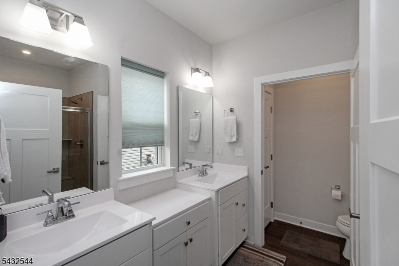 21 Harris Hawk Road Washington, NJ 07882 - Photo 16 of 26 a bathroom with a double vanity sink mirror and double