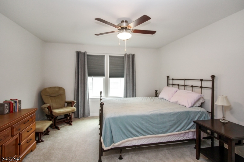 21 Harris Hawk Road Washington, NJ 07882 - Photo 20 of 26 a bedroom with a bed and a window