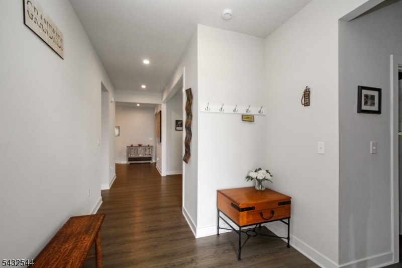 21 Harris Hawk Road Washington, NJ 07882 - Photo 2 of 26 a view of a hallway with wooden floor and a elevator