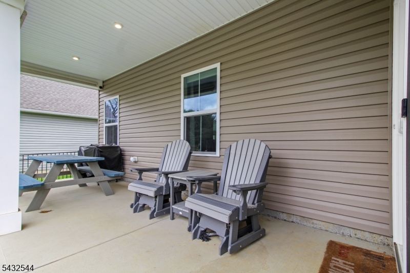 21 Harris Hawk Road Washington, NJ 07882 - Photo 22 of 26 a view of a chairs and table in patio