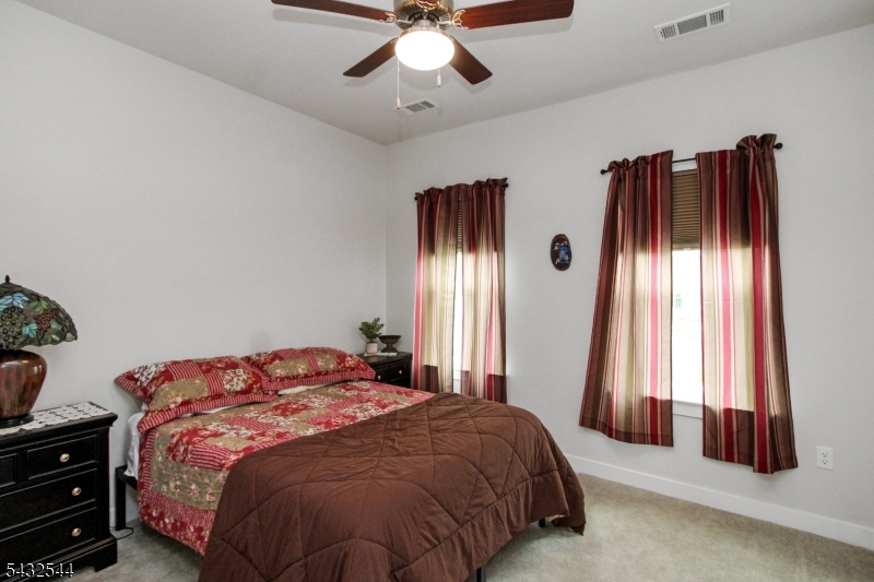 21 Harris Hawk Road Washington, NJ 07882 - Photo 3 of 26 a bedroom with a bed and window