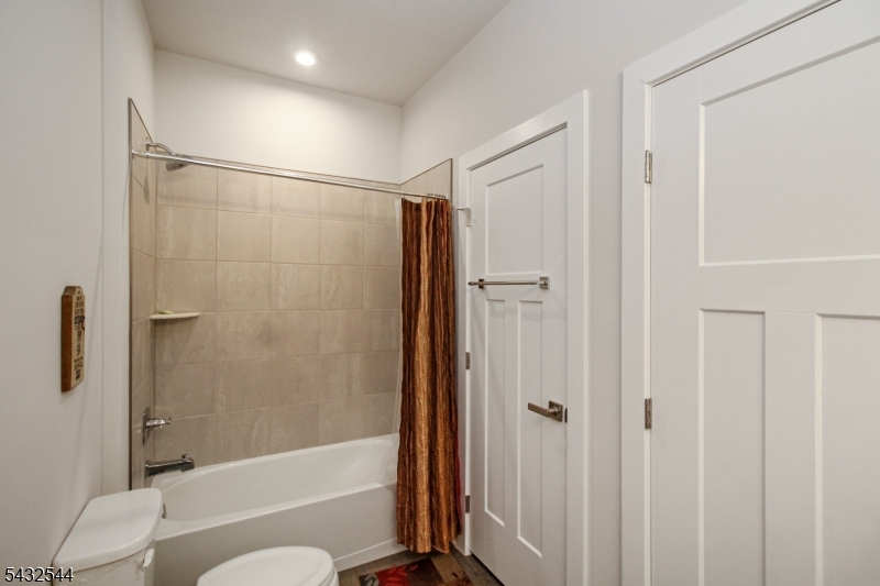 21 Harris Hawk Road Washington, NJ 07882 - Photo 4 of 26 a bathroom with a shower a toilet and a shower