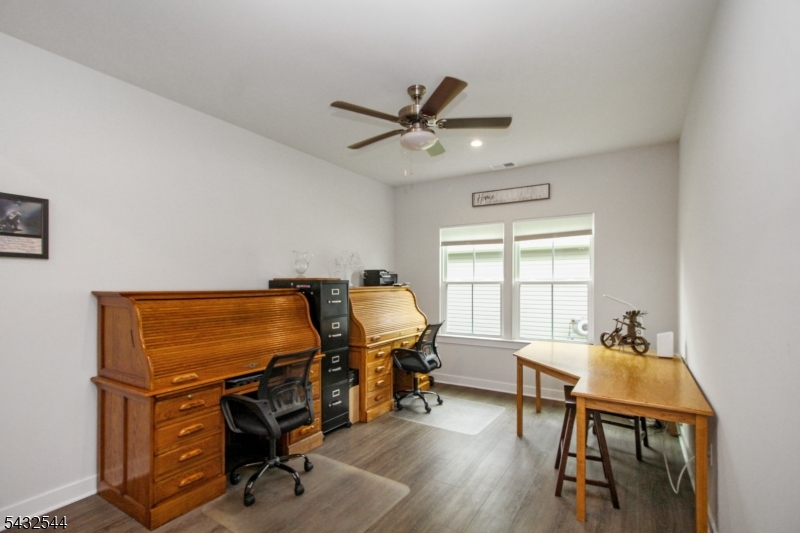 21 Harris Hawk Road Washington, NJ 07882 - Photo 5 of 26 a view of a workspace with furniture and a window